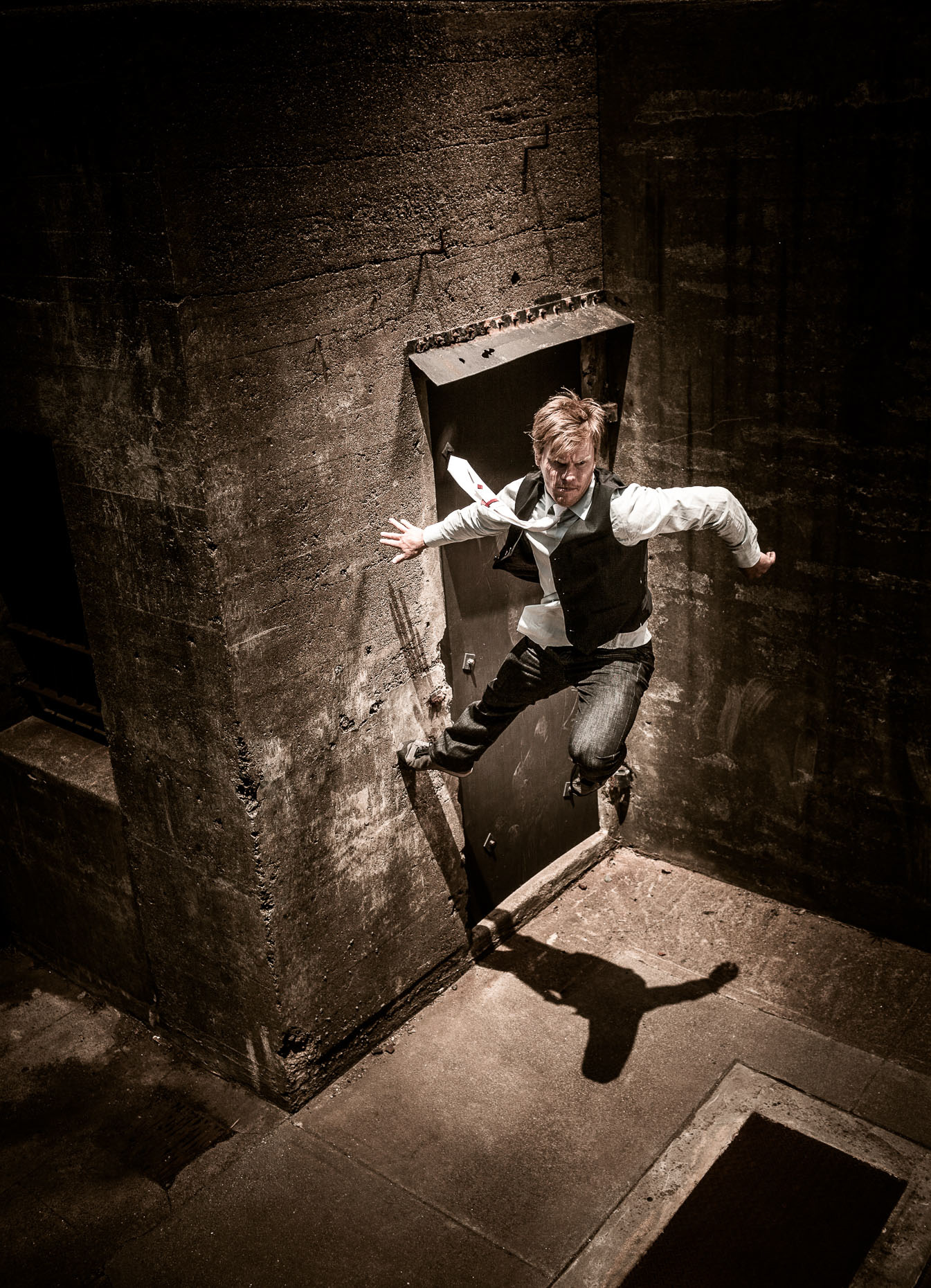 parkour freerunner athlete brian orosco jumps off wall at the Presidio army bunkers by andy batt