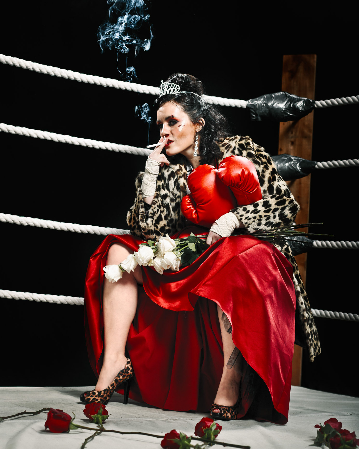 Editorial portrait of Stacey Hallal as a beauty pagaent queen in the  "Miss Irregardless" boxing talent competition at the Curious Comedy Theater in Portland, Oregon. In this scene, she