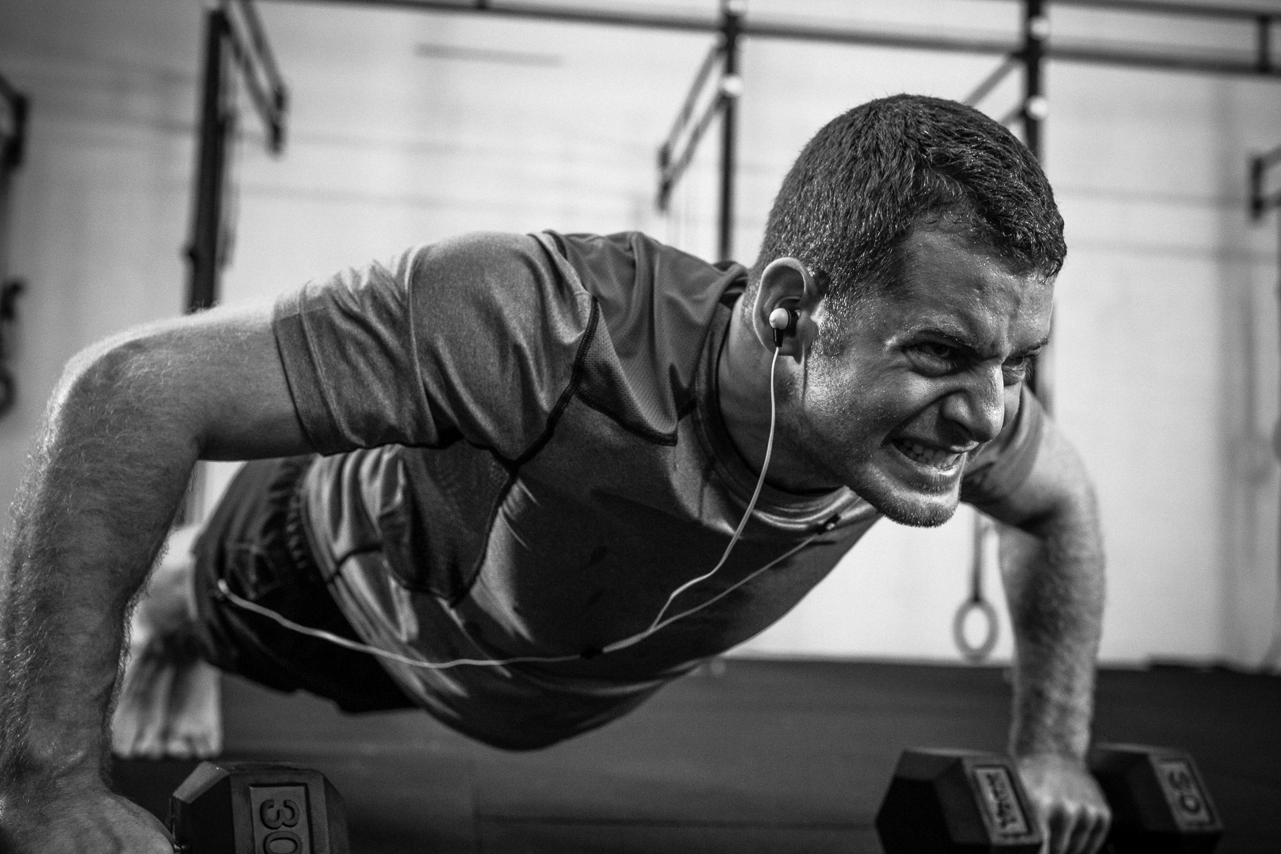 Gym training pushups for Monster iSport with MMA fighter athlete Will Hatcher in a crossfit gym by Andy Batt