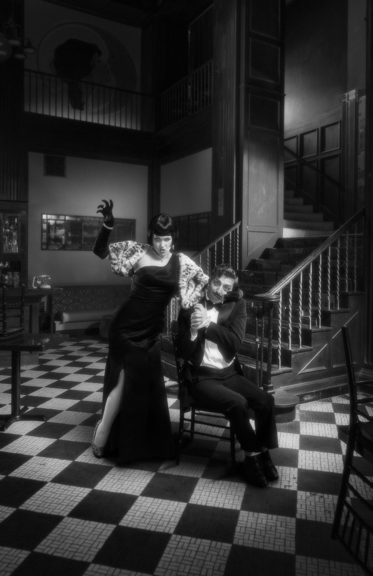 B&W entertainment portrait of actors Amber Nash and Sean McGrath in Leopard Lady. The scene is a 1900