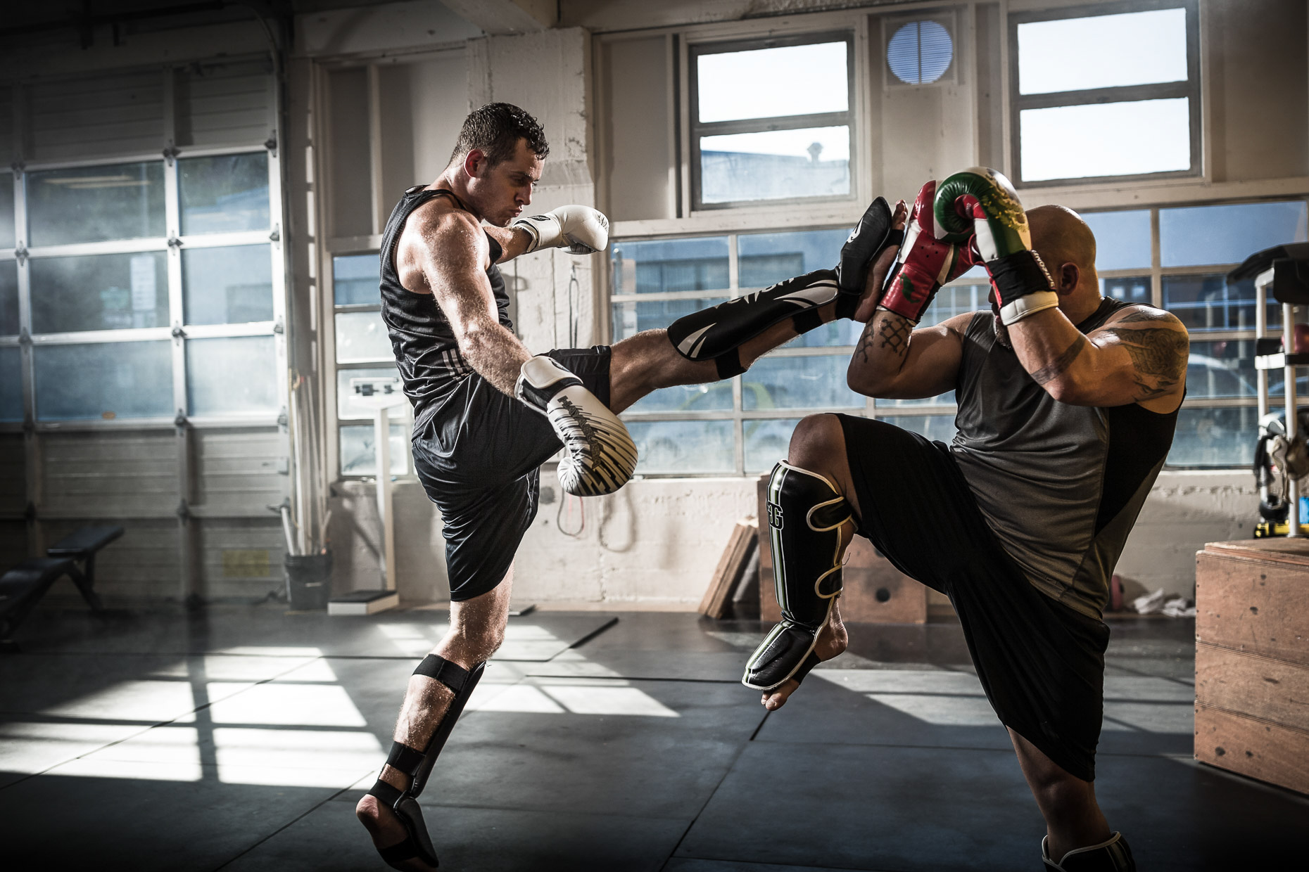 MMA athletes Jose Rogriguez and Will Hatcher  training in a crossfit gym by Andy Batt 