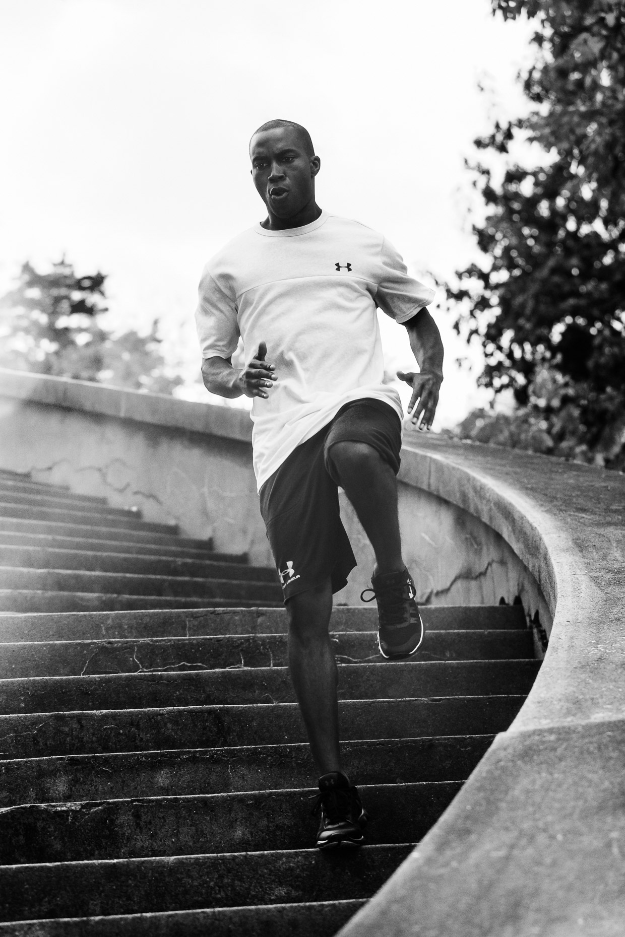 Running athlete trains down a staircase for Hibbett Sports in a Birmingham park by Andy Batt