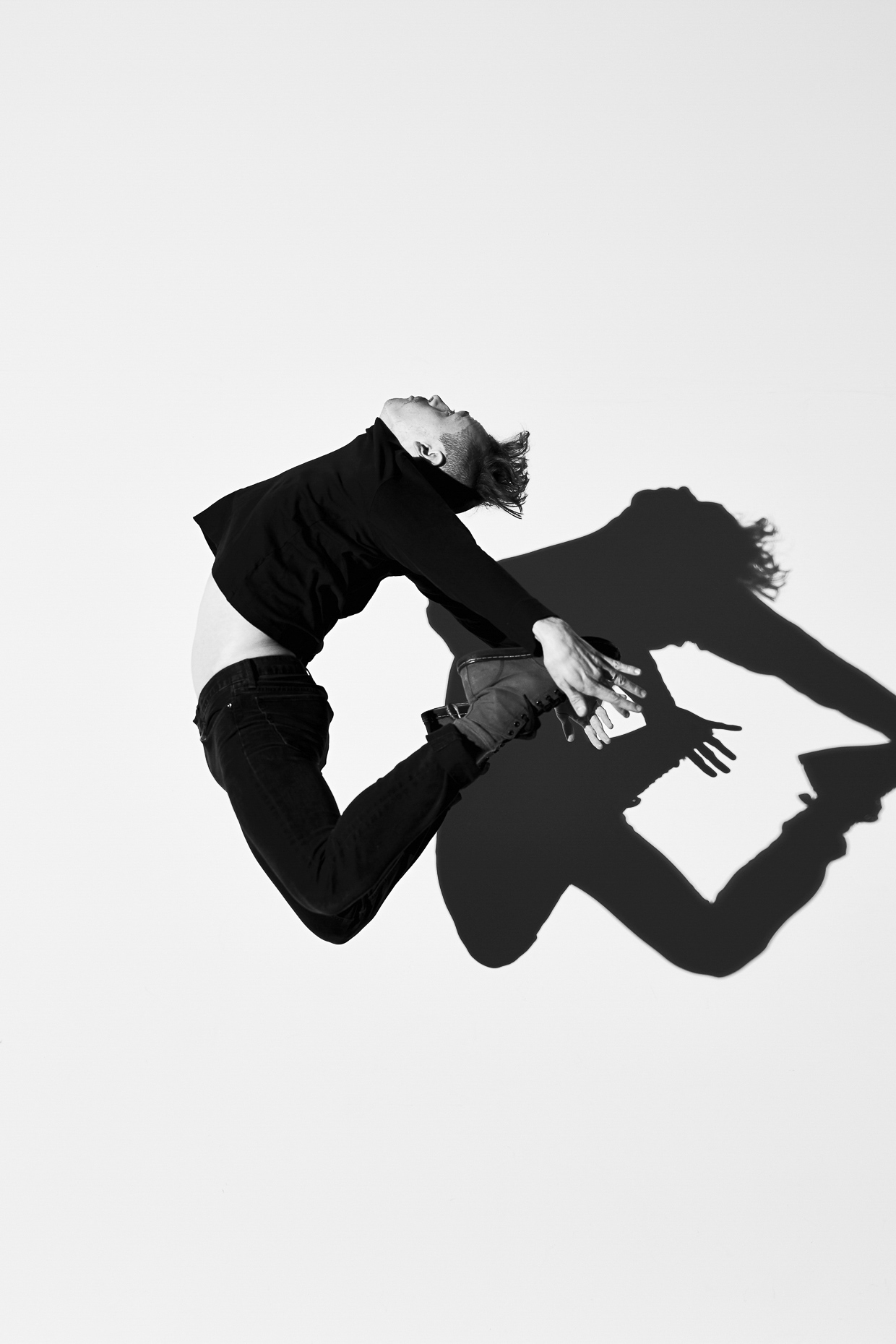 B&W of Urban dancer Daniel Giron jumps and dances by Andy Batt