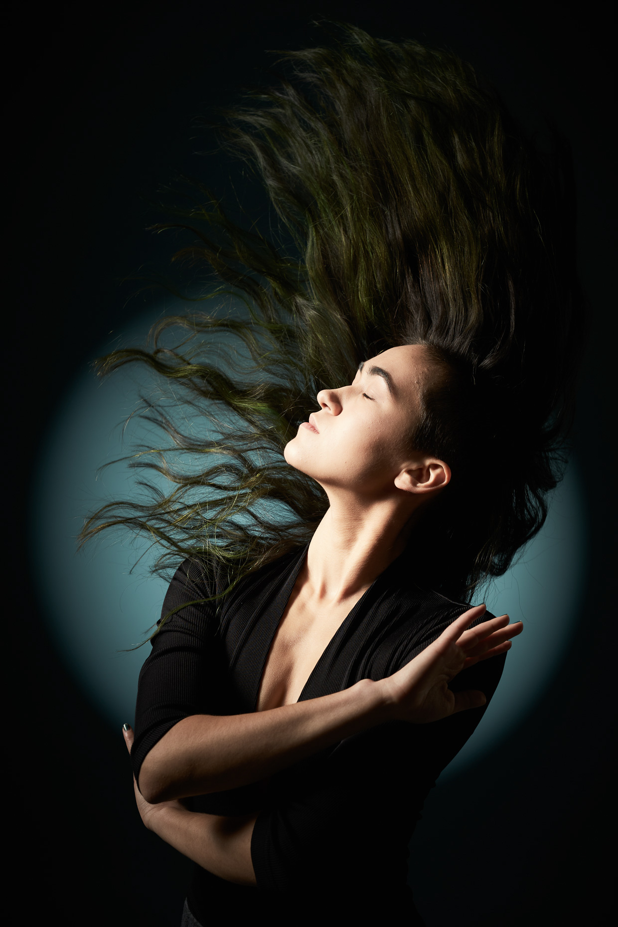 Editorial portrait of Sexy Heels dance instructor Paula Metzler flipping her hair by Andy Batt