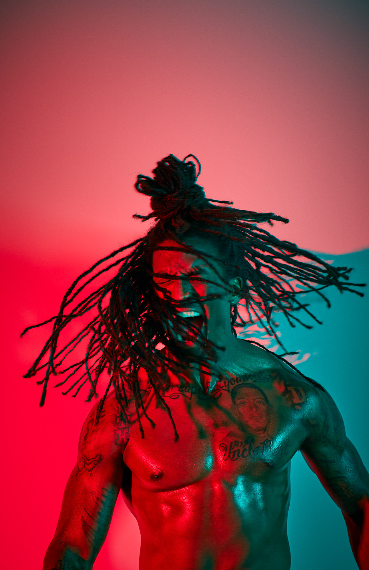 Nike basketball tight portrait of Xavier Taylor  with colorfulred gels by Andy Batt 