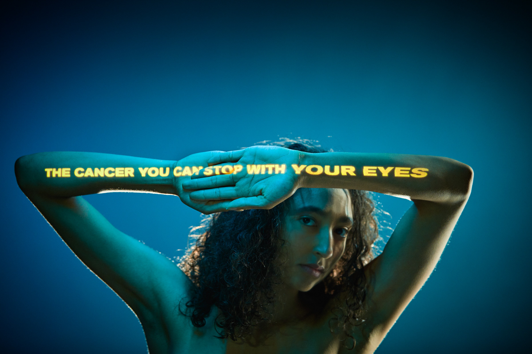 Start Seeing Melanoma campaign for OHSU war on skin cancer with dancer Kayla. Words projected onto her skin read "The cancer you can stop with your eyes" by Andy Batt
