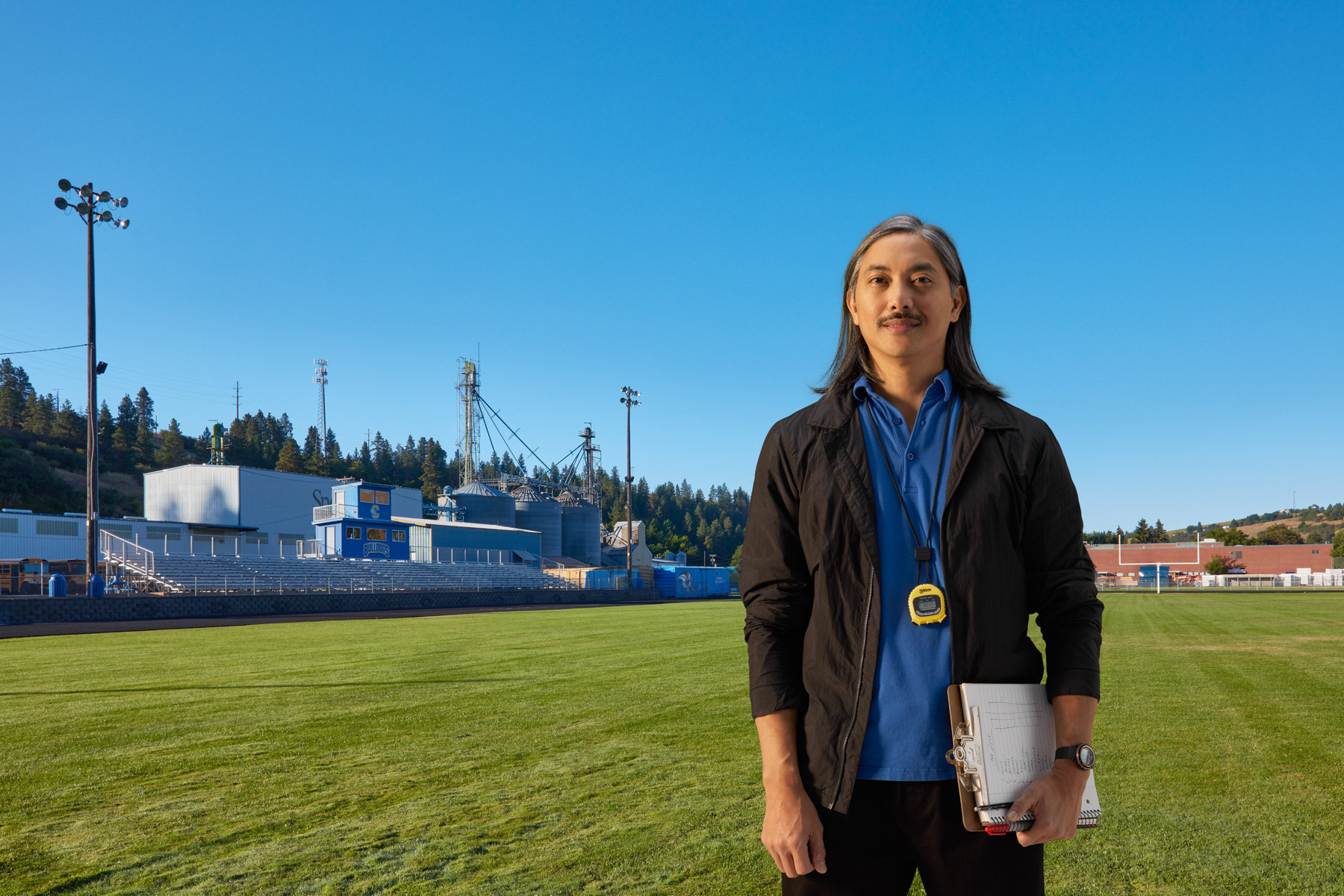 Football coach with timer on football field in Colfax, Washington