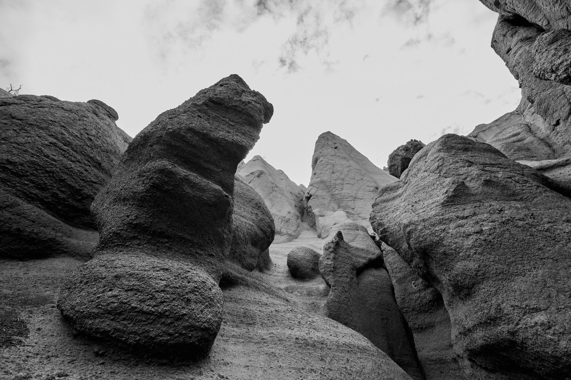Red Mountain Hoodoos-b&w looking up at eroded pillar hoodoo rocks inside extinct volcano