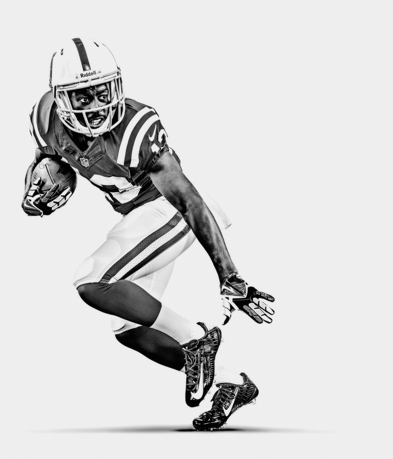 NFL Verizon Ty Hilton defends football for the Indianapolis Colts in a white studio b&w by Andy Batt 